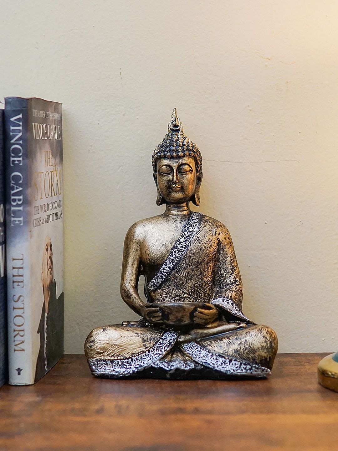 StatueStudio Gold-Toned Buddha Statue With Tealight Holder Showpiece Price in India