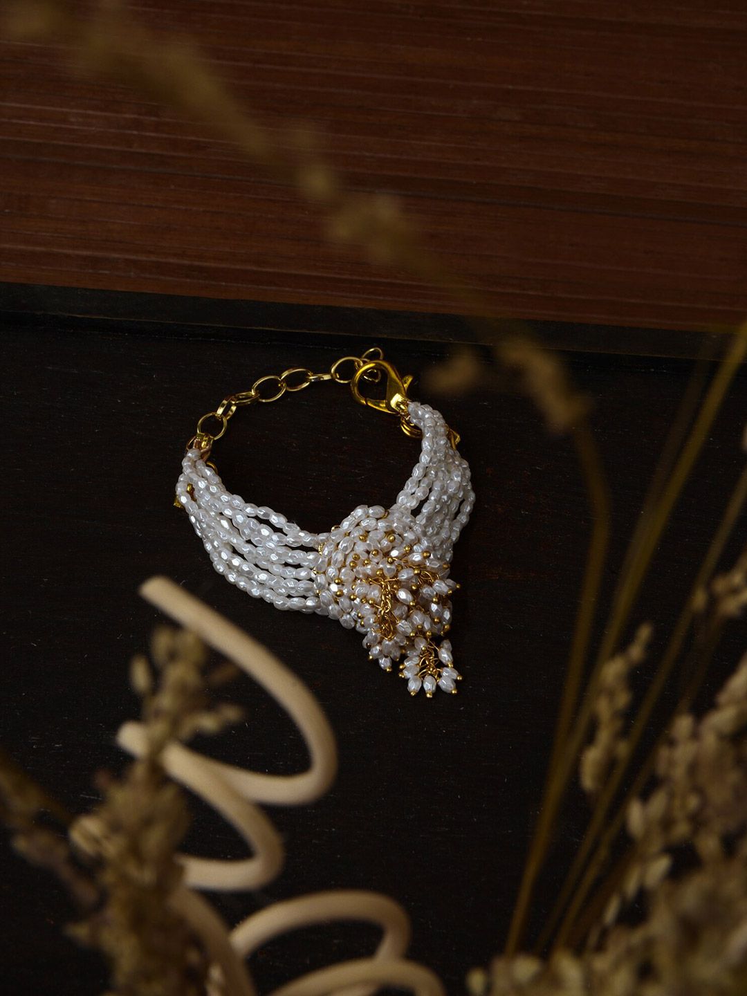 D'oro Women Gold-Toned & White Handcrafted Gold-Plated Wraparound Bracelet Price in India