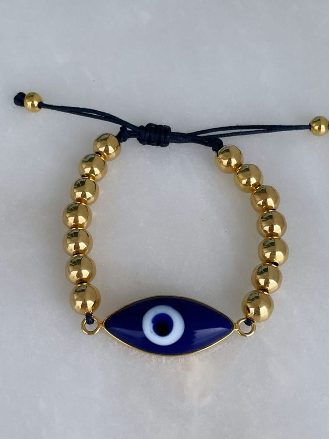 MNSH Women Gold-Plated & Blue Brass Wraparound Evil Eye Bracelet Price in India