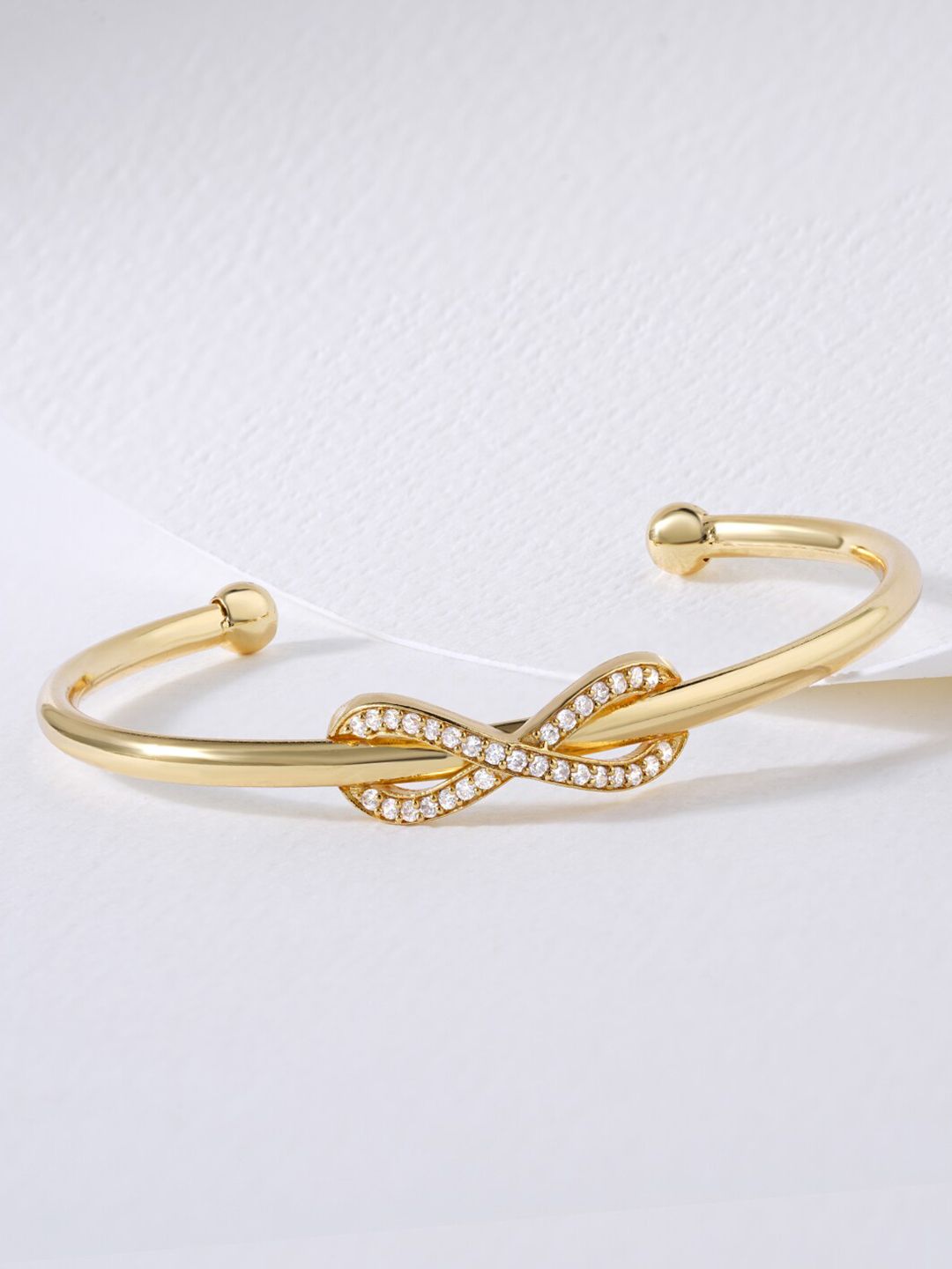 MINUTIAE Women Gold-Plated & White Brass Crystals Flexible Cuff Bracelet Price in India