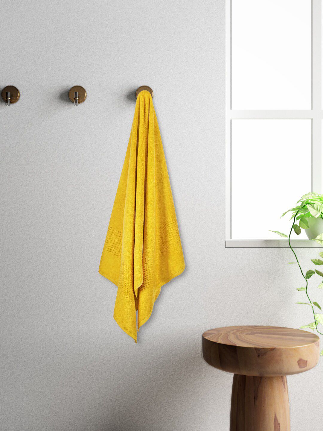 SPACES Unisex Yellow Textured 450GSM Pure Cotton Bath Towel Price in India