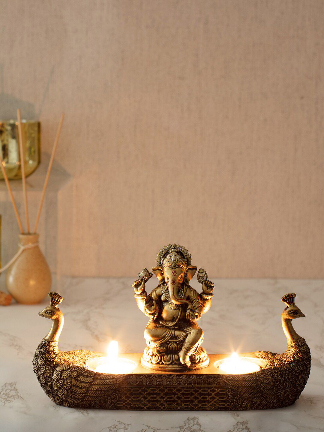 HomeTown Gold-Toned Textured Ganesha Hand Finished Figurine With Tealight Holder Price in India