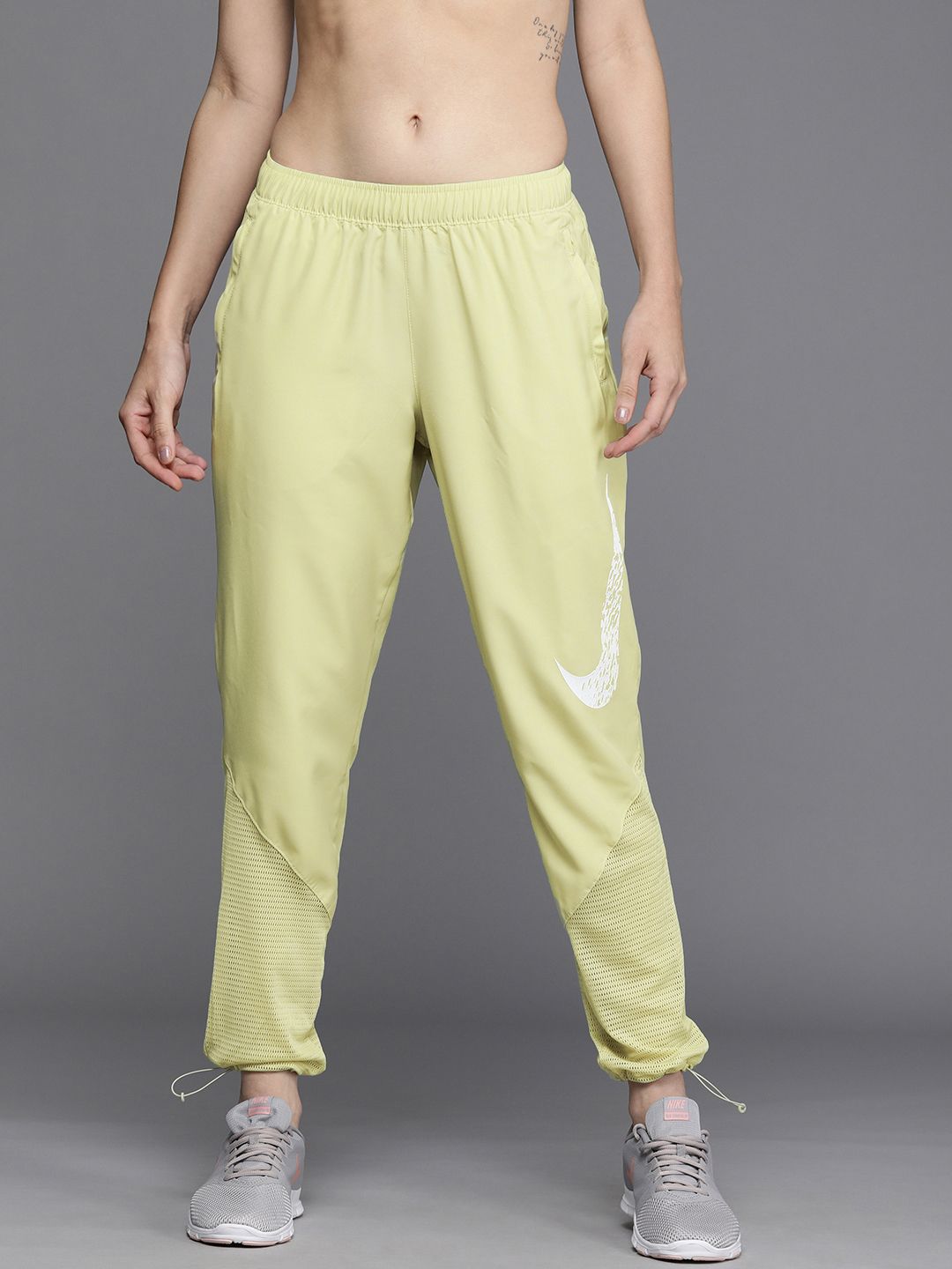 Nike Women Lime Green Brand Logo Printed Mid-Rise Swoosh Run Regular Joggers Price in India