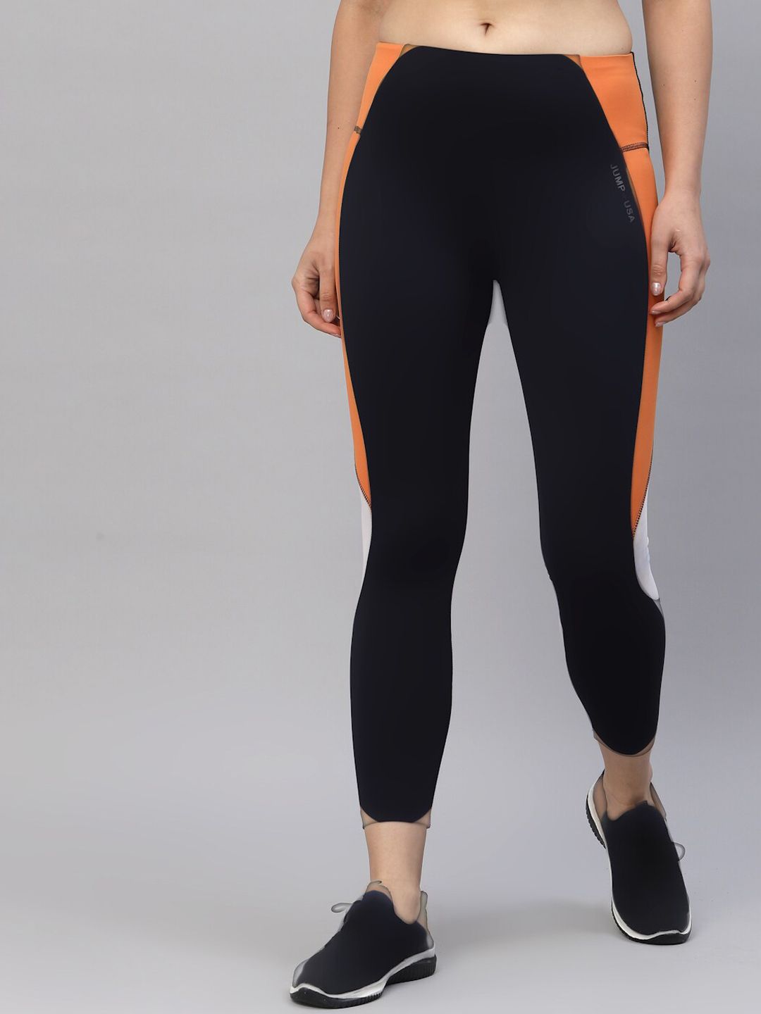 JUMP USA Women Black & Orange Colorblocked Rapid-Dry Training & Gym Tights Price in India