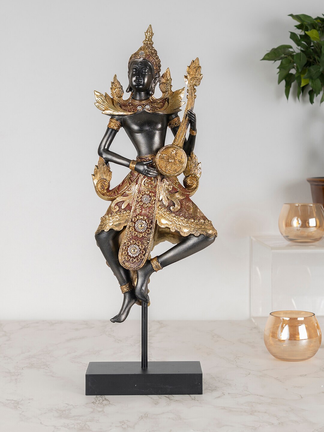 HomeTown Gold-Toned & Black Zen Musical Buddha Figurine Showpieces Price in India