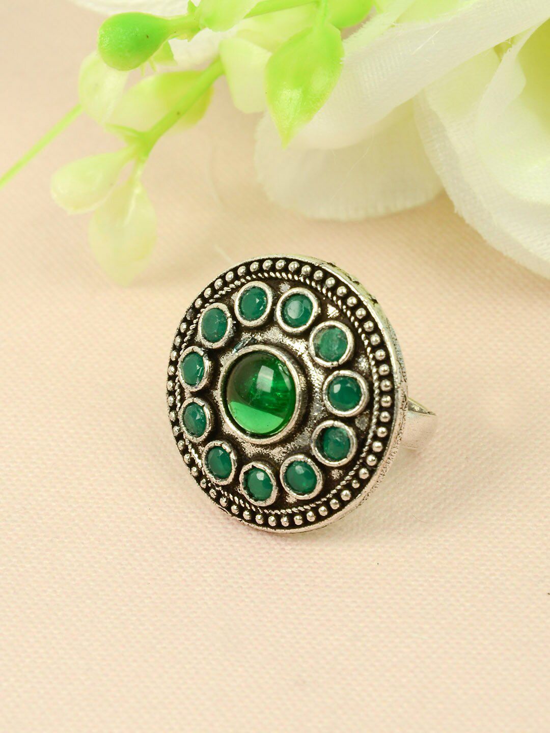 Urmika Women Silver-Toned & Green Crystal-Studded Circular Oxidized Finger Ring Price in India