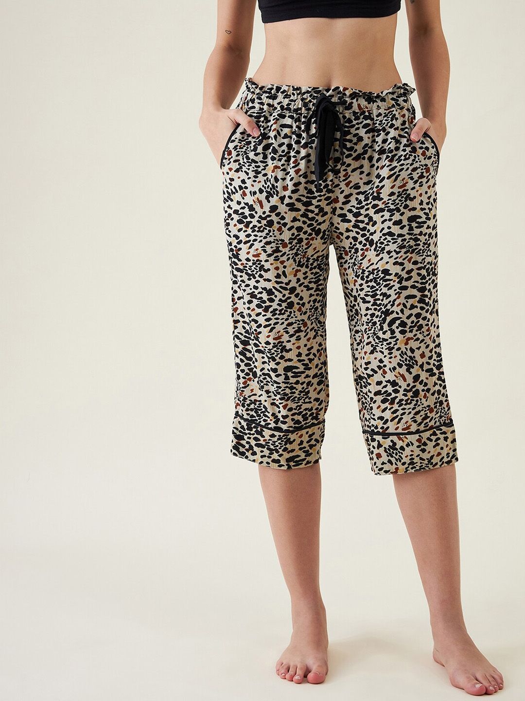 The Kaftan Company Women Beige & Black Animal Printed Lounge Pants Price in India