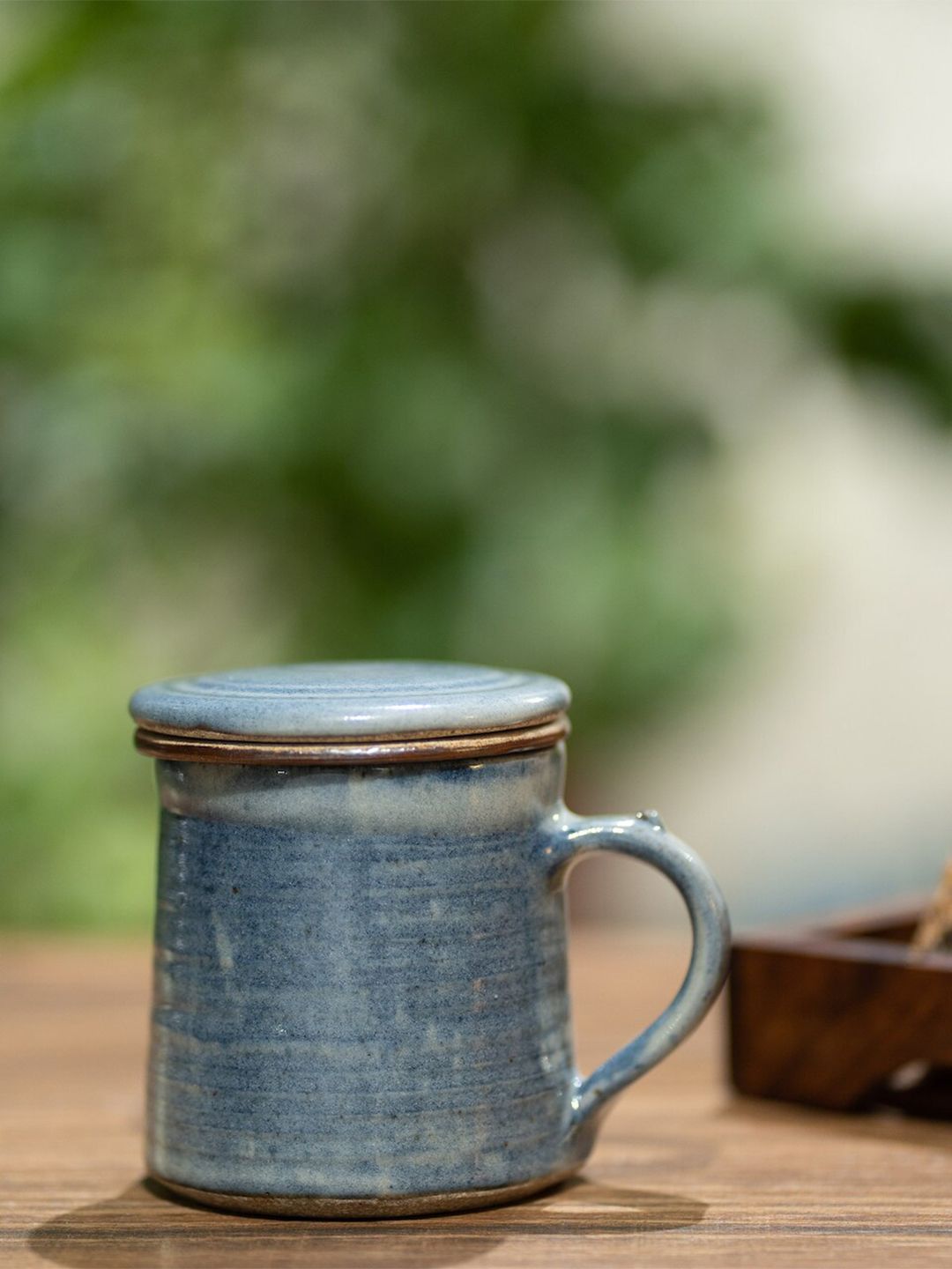 nakshikathaa Blue & Copper-Toned Handcrafted and Hand Painted Solid Ceramic Matte Mug with Filter and Lid Price in India