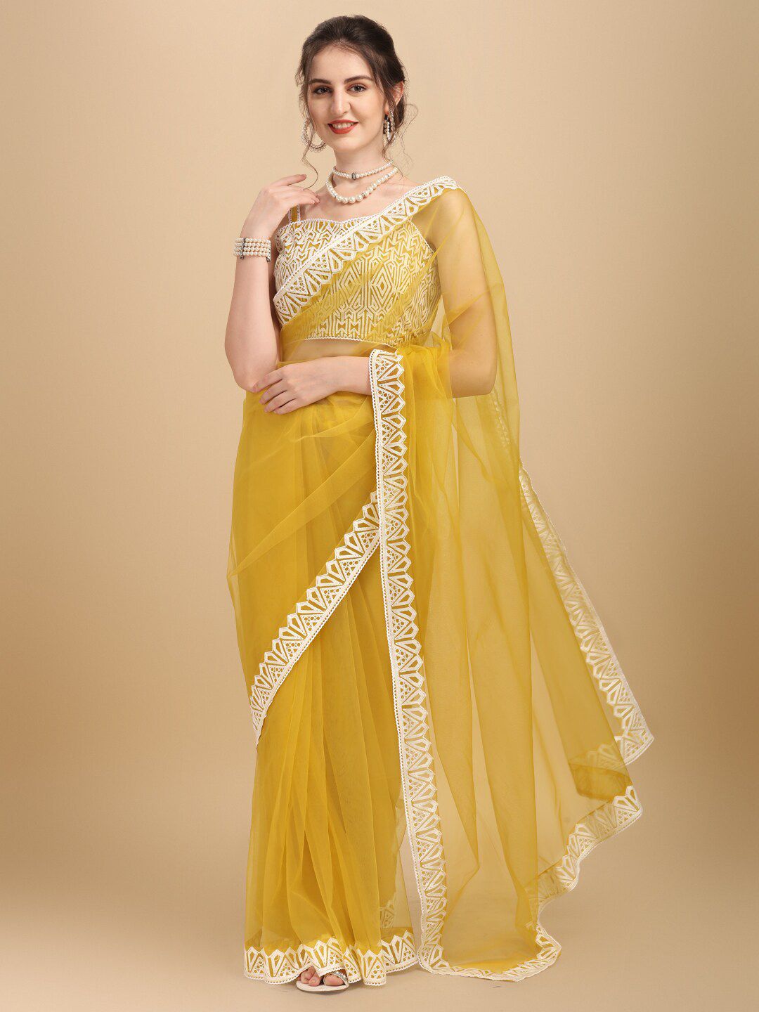 Inddus Yellow & White Solid Embroidered Net Saree Price in India