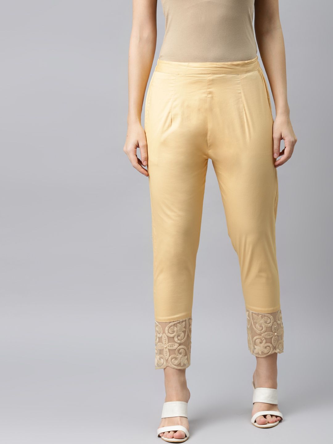 RIVI Women Golden Embroidered Hem Cotton Ethnic Trousers Price in India