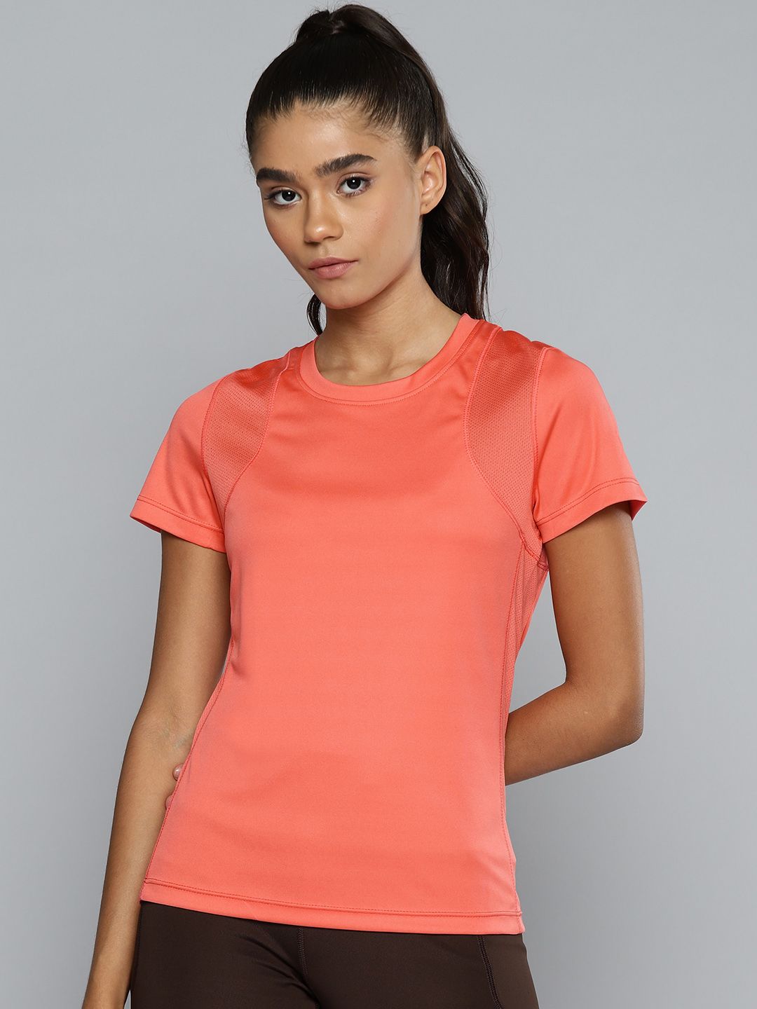 Alcis Women Coral Pink Solid Slim Fit T-shirt Price in India