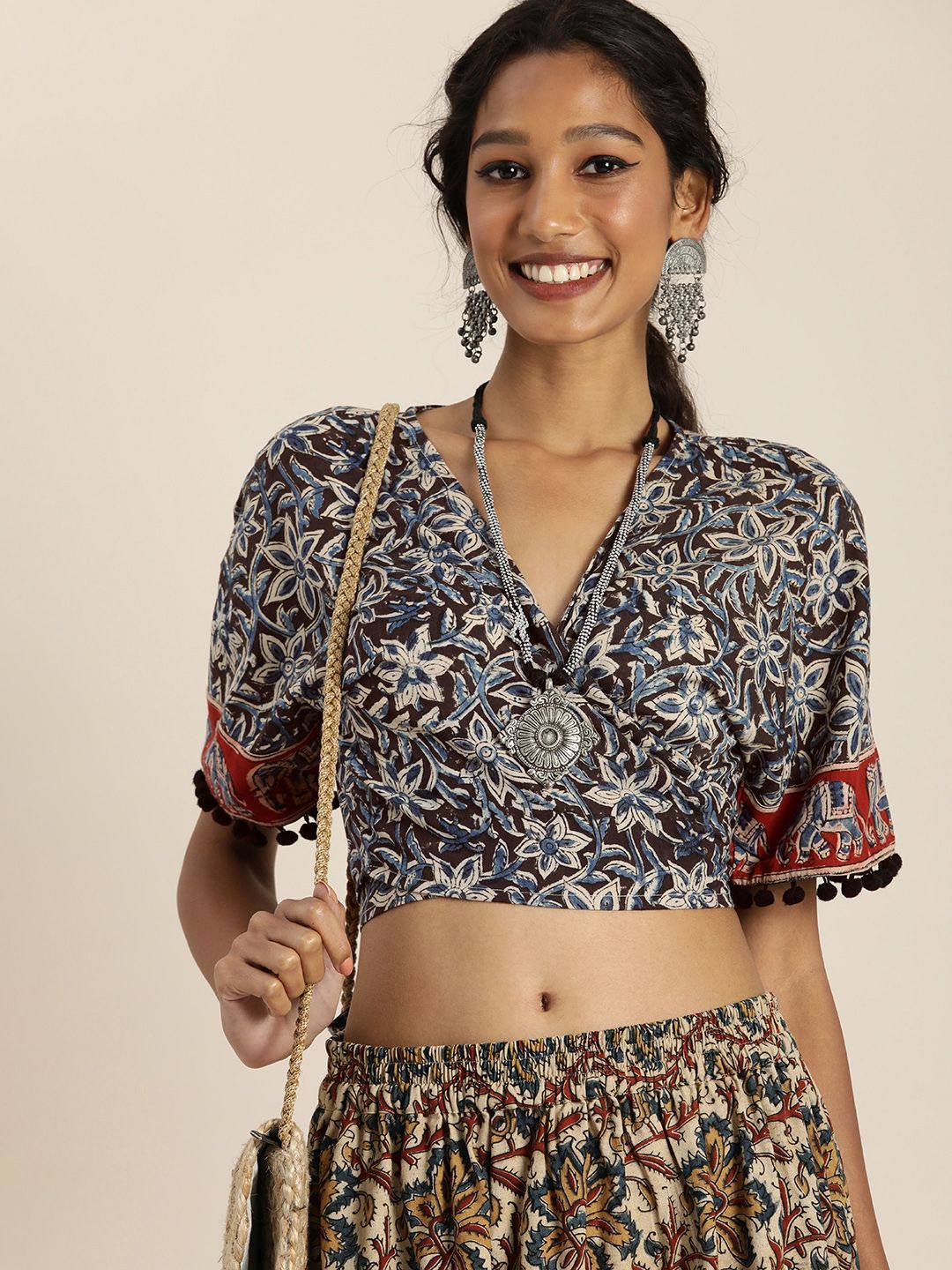 Taavi Women Black & Blue Kalamkari Printed Wrap Crop Top With Waist Tie-Ups Price in India