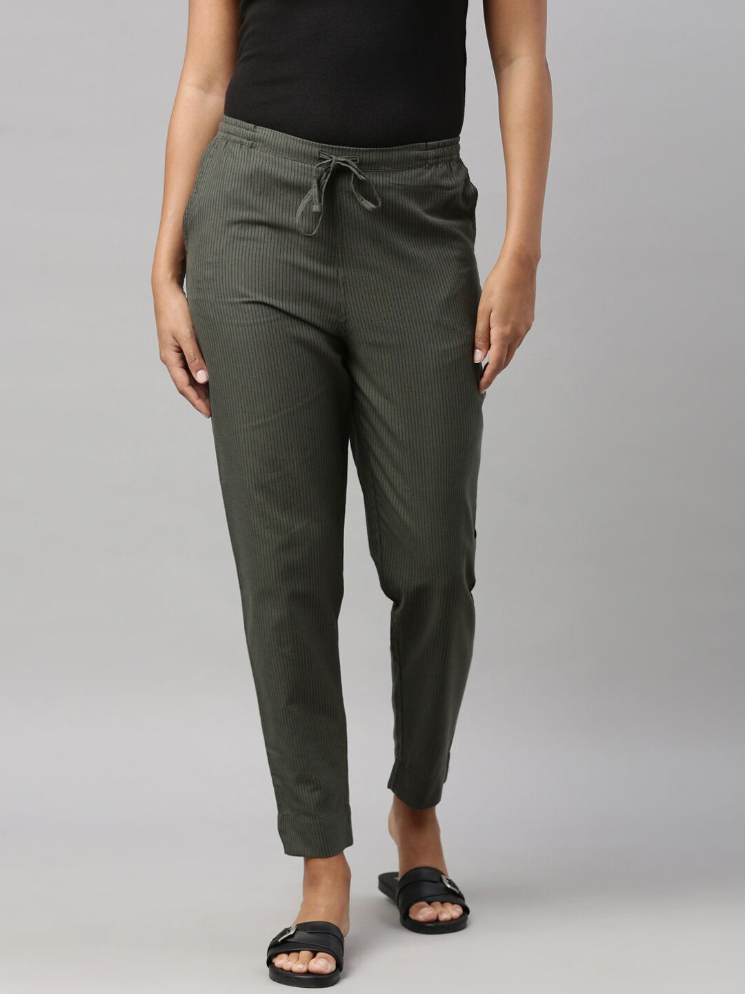 Go Colors Women Olive Green Tapered Fit Pleated Chinos Trousers Price in India