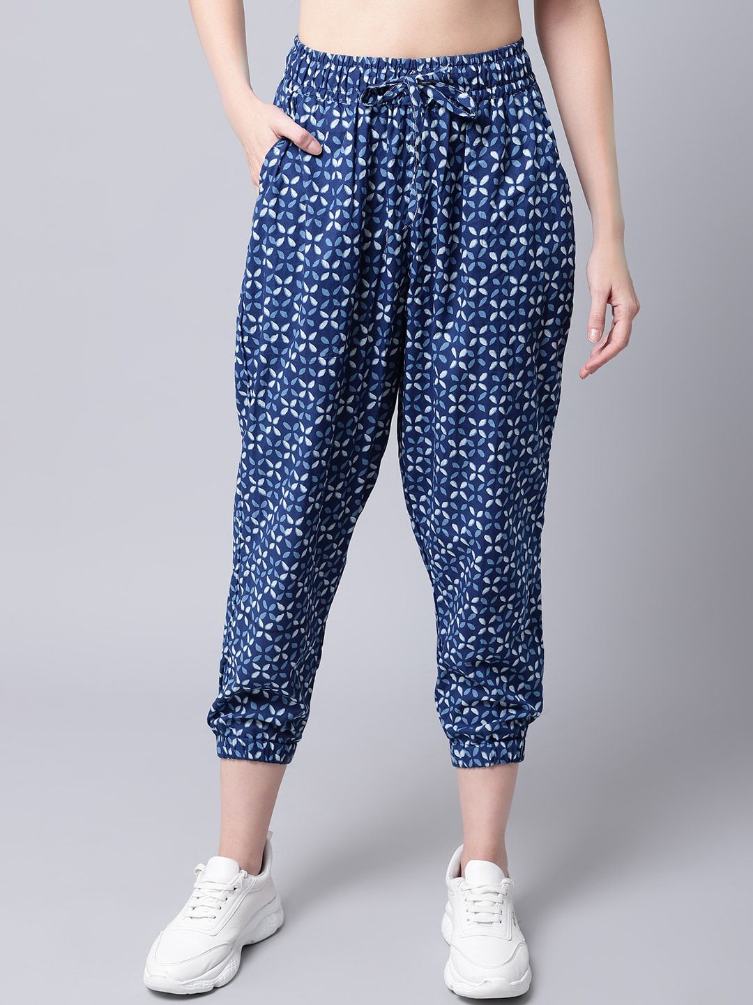 TAG 7 Women Blue Printed Smart Loose Fit Joggers Trousers Price in India