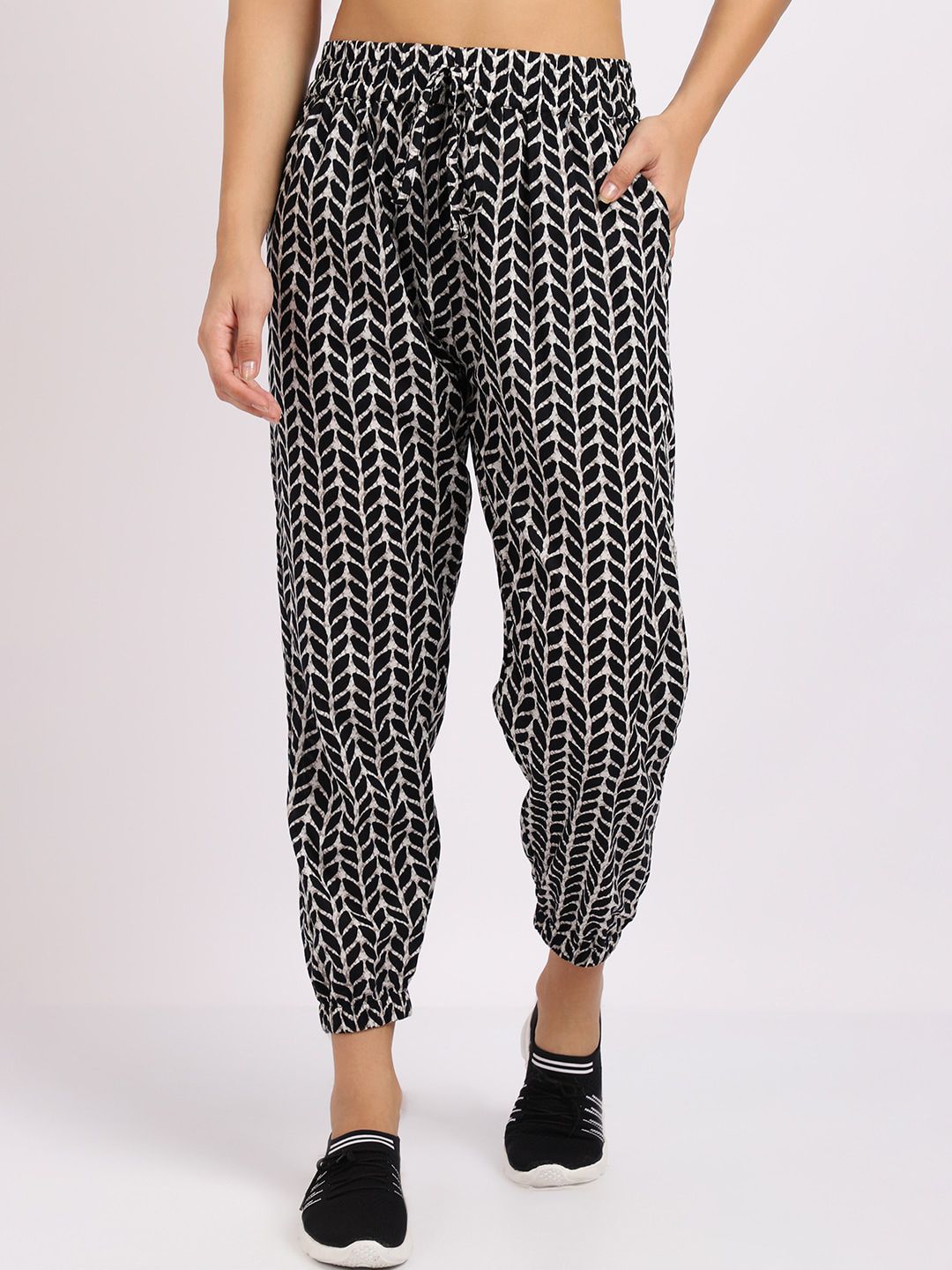 TAG 7 Women Black Printed Smart Loose Fit Pleated Joggers Trousers Price in India