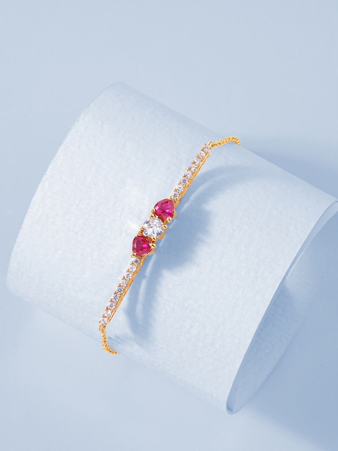MINUTIAE Women Gold-Toned & Pink Brass Crystals Gold-Plated Link Bracelet Price in India