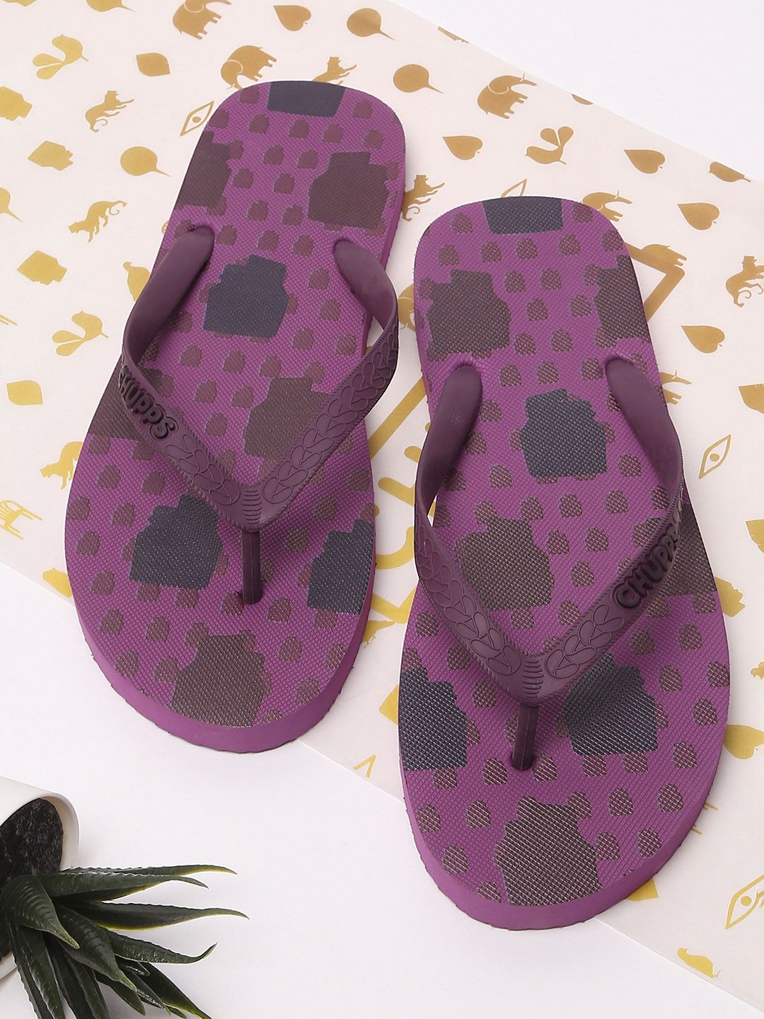 CHUPPS Women Purple & Black Printed Rubber Thong Flip-Flops Price in India