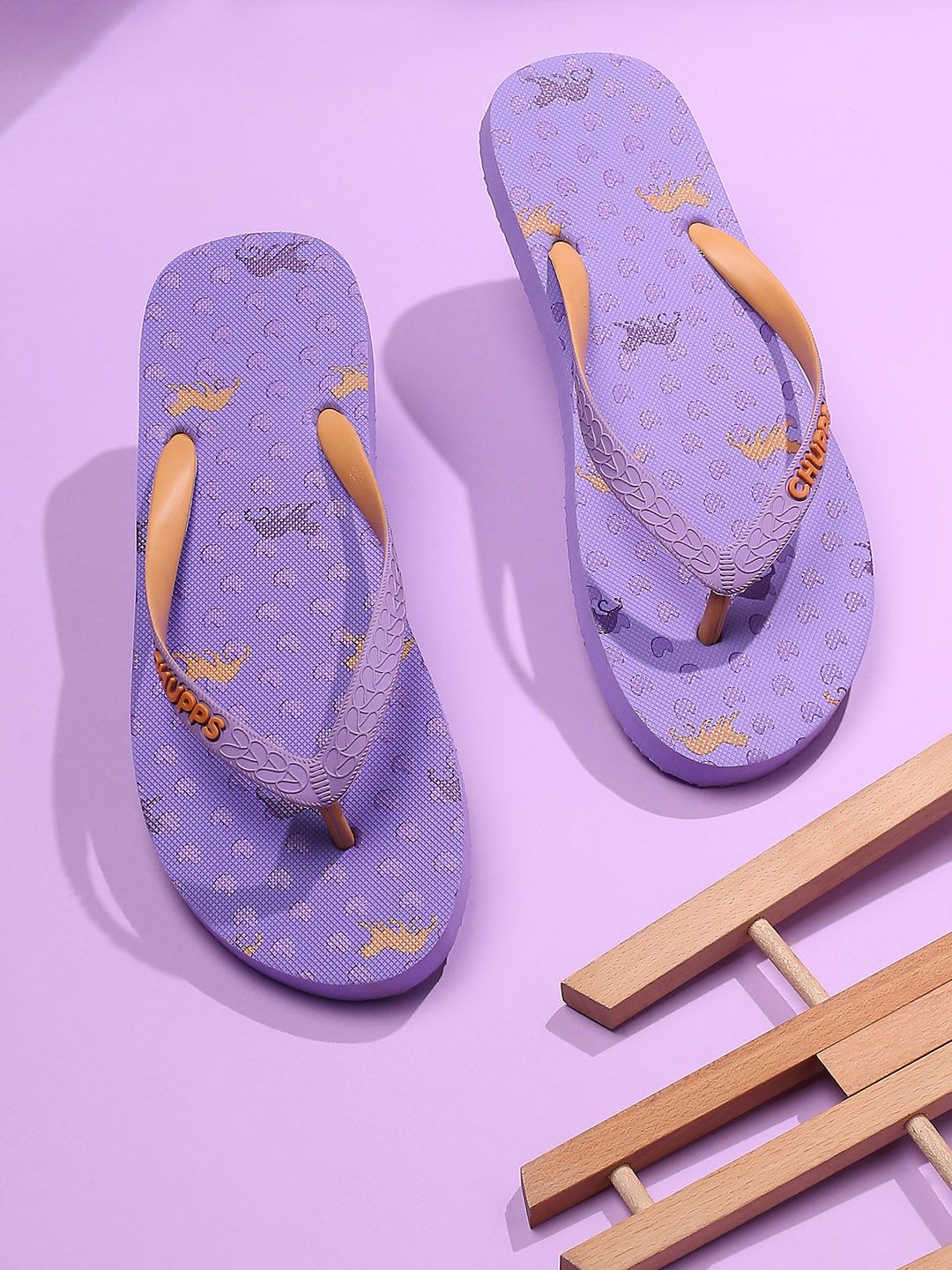 CHUPPS Women Purple & Orange Printed Rubber Thong Flip-Flops Price in India