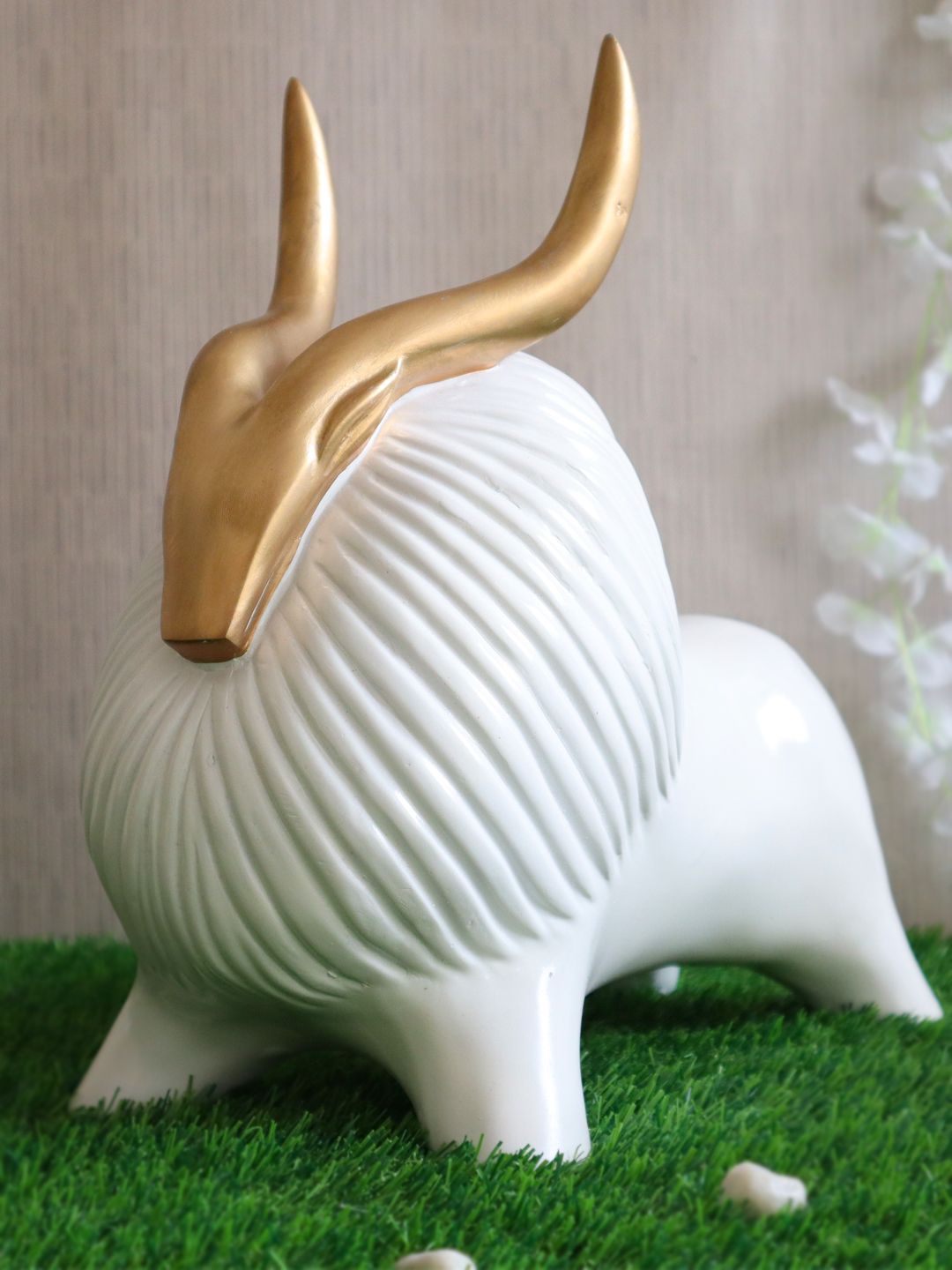 TIED RIBBONS White & Gold-Toned Polyresin Yak Statue Showpiece Price in India