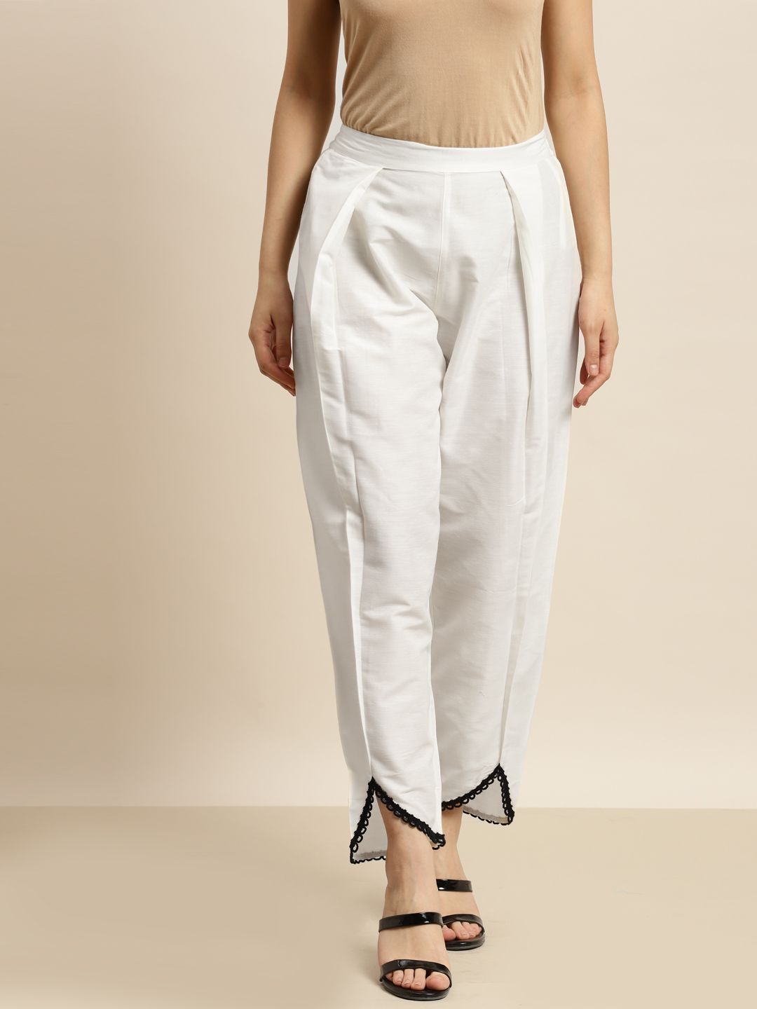 Shae by SASSAFRAS Women Off White Solid Lace Detail Hem Pleated Tulip Trousers Price in India