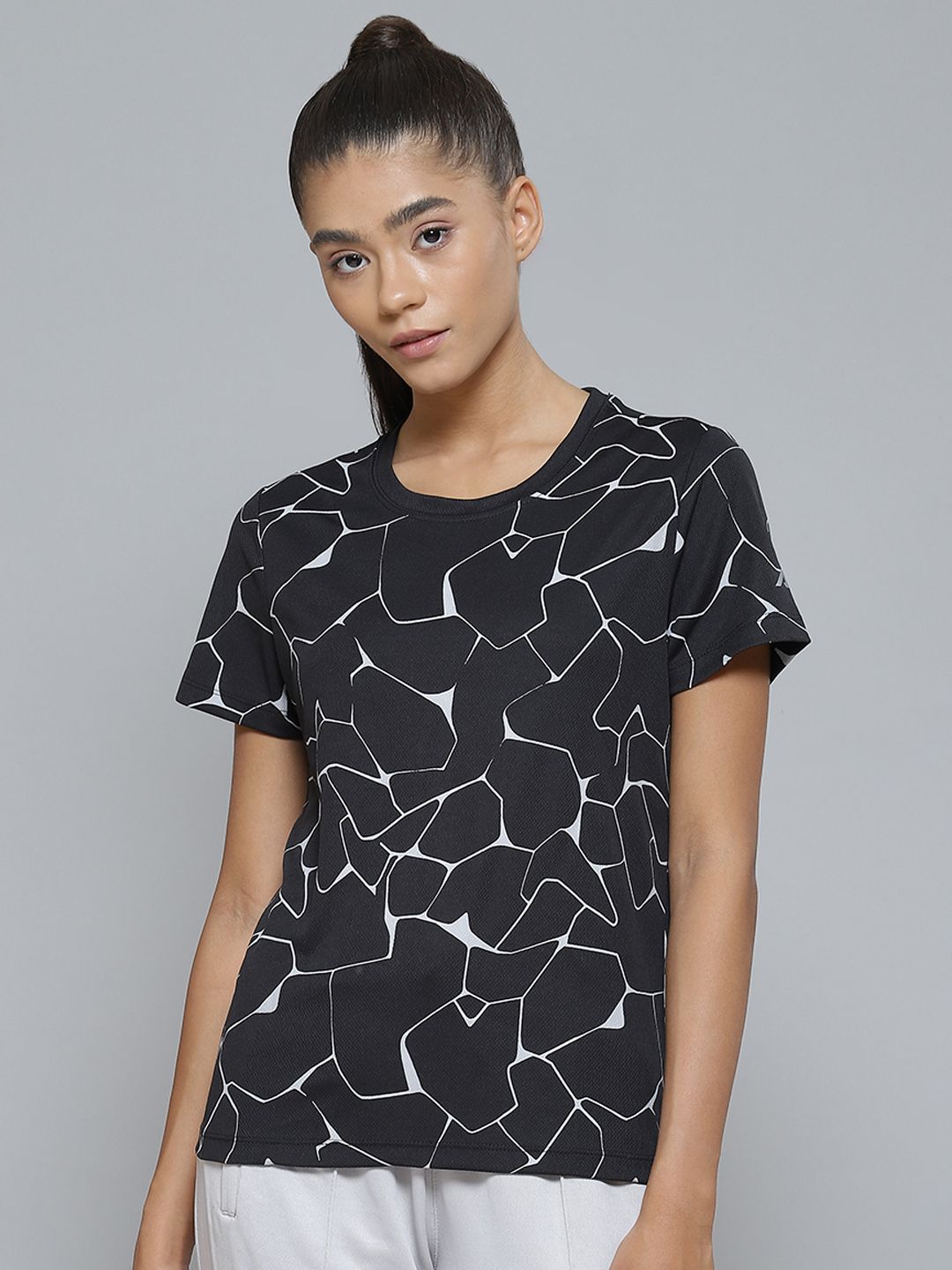 Alcis Women Black & White Printed Monochrome Slim Fit T-shirt Price in India