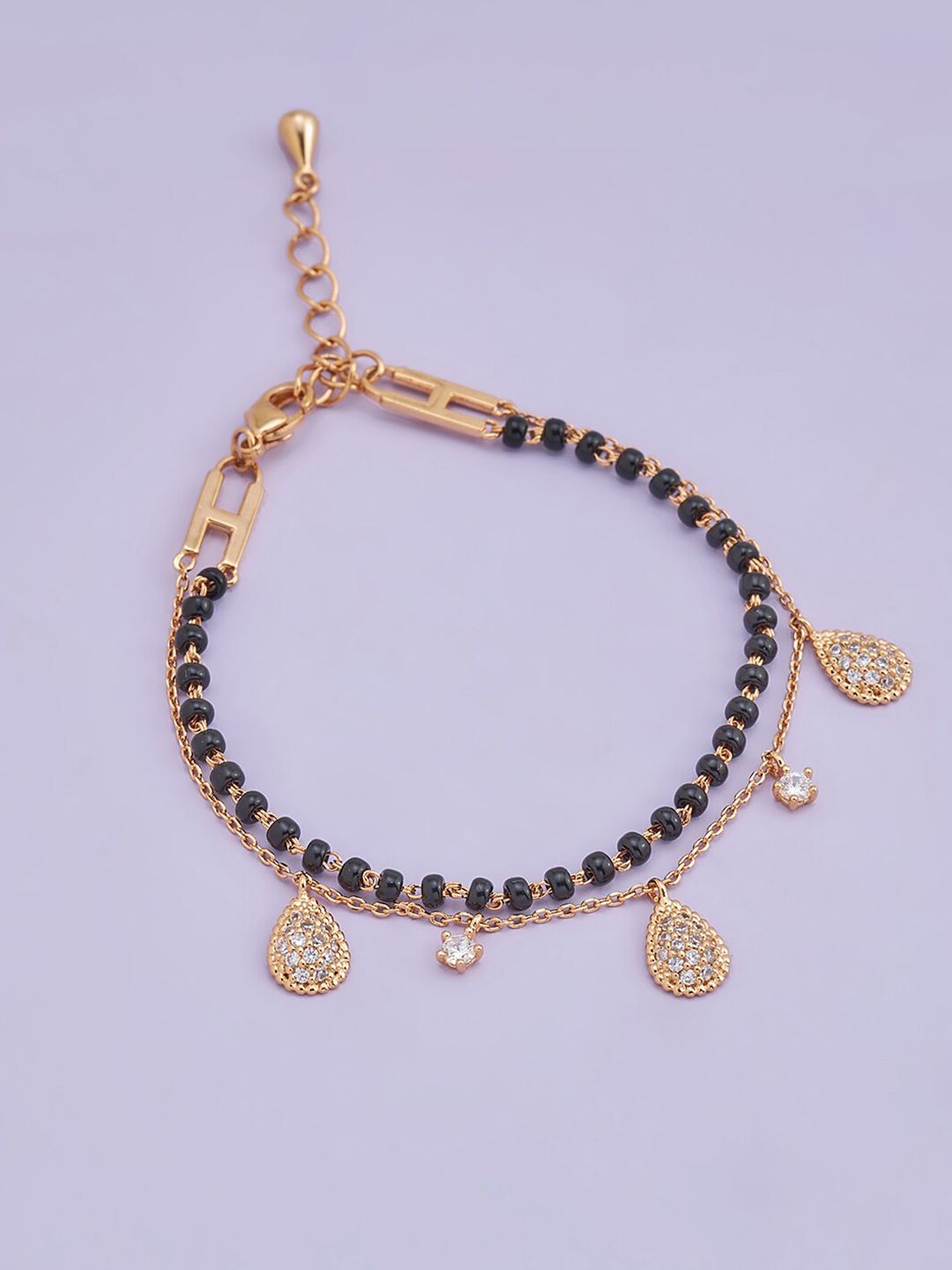 Kushal's Fashion Jewellery Women Black & Rose Gold Toned & Plated Charm Bracelet Price in India