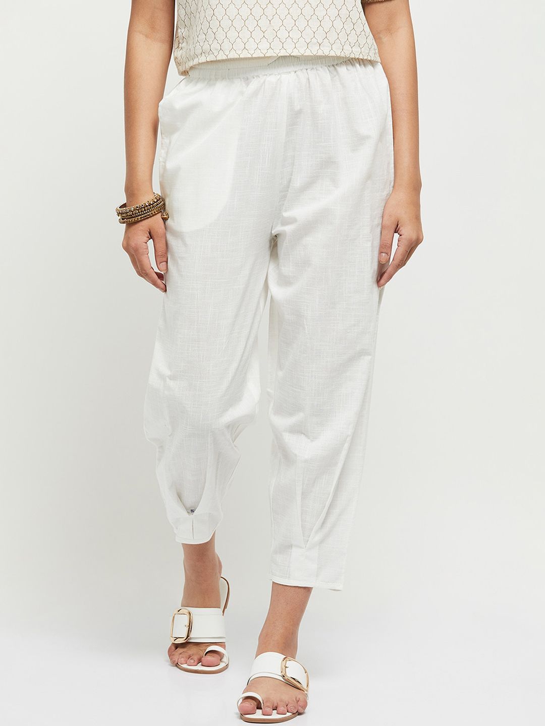 max Women Off-White Solid Cotton Crop Peg Trousers Price in India