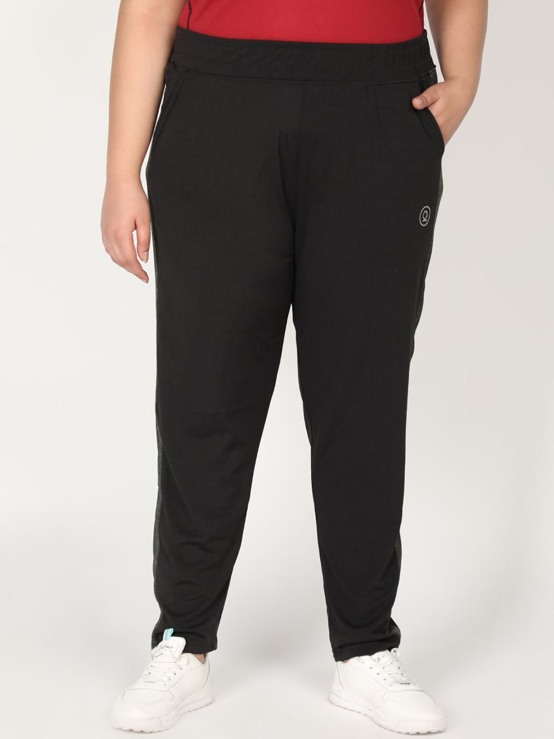 CHKOKKO Plus Women Black Solid Track Pants Price in India