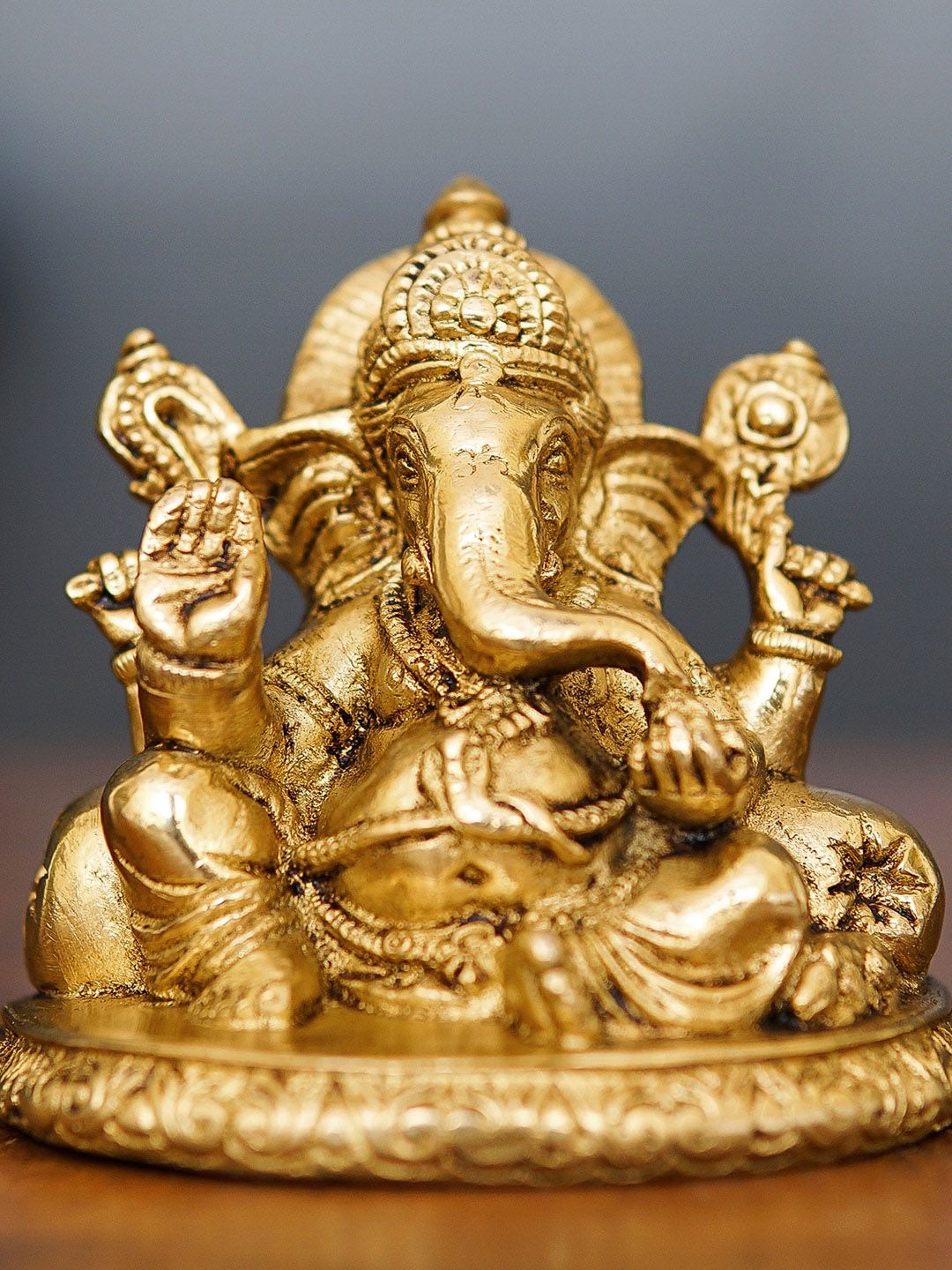 StatueStudio Gold-Toned  Ganesha Idol Showpiece Price in India