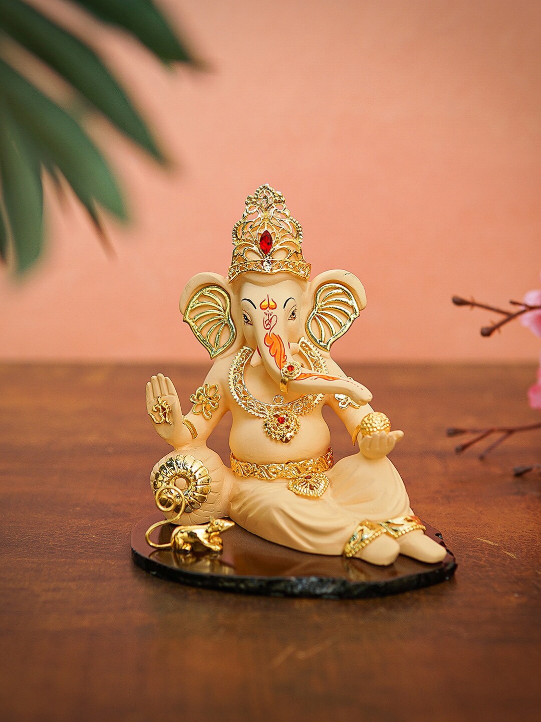 StatueStudio Gold-Toned  Reclining Ganesha Idol Showpieces Price in India