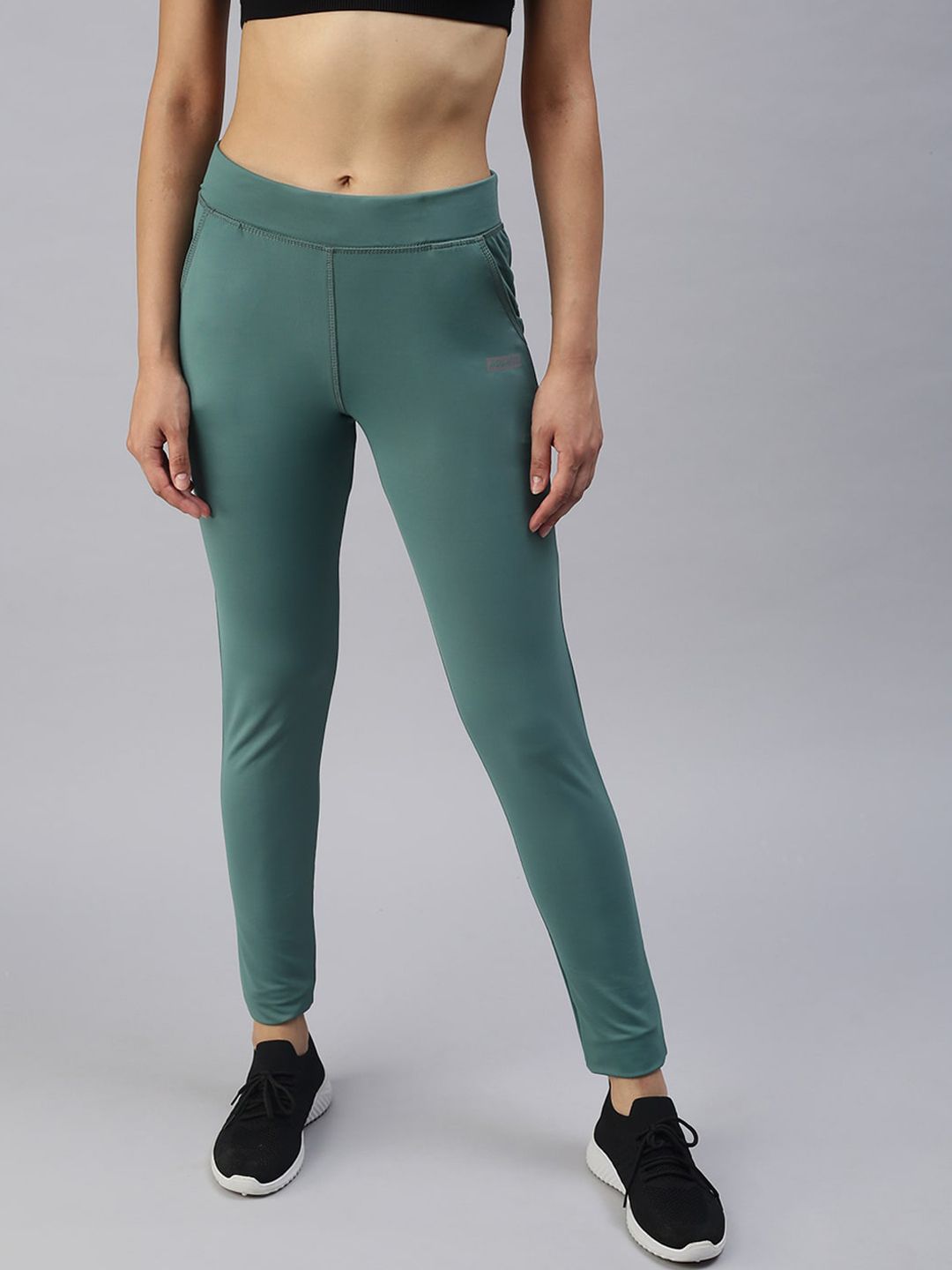 SHOWOFF Women Green Solid Slim Fit Dry Fit Regular Track Pants Price in India