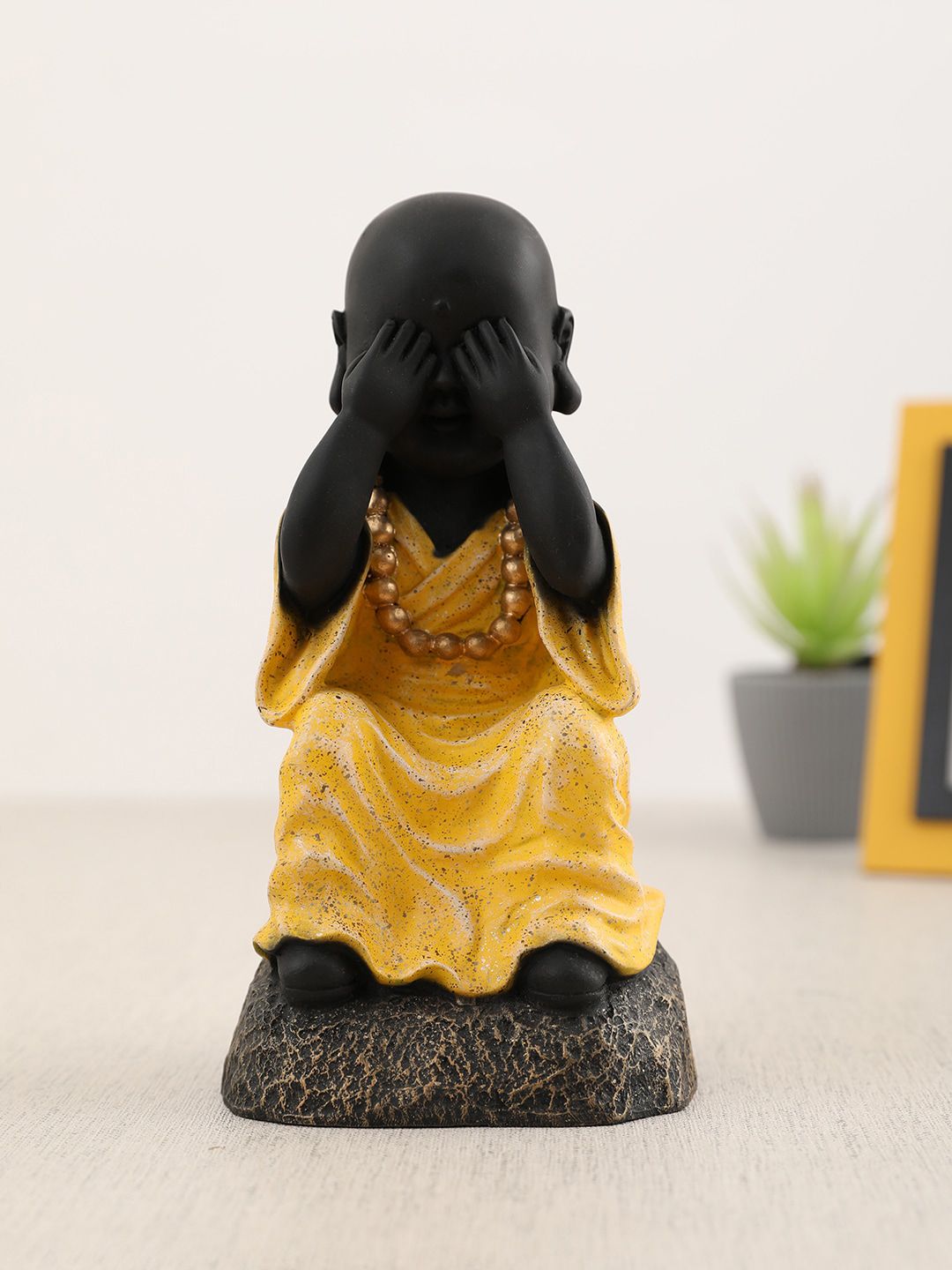 HomeTown Yellow & Black Monk Showpieces Price in India