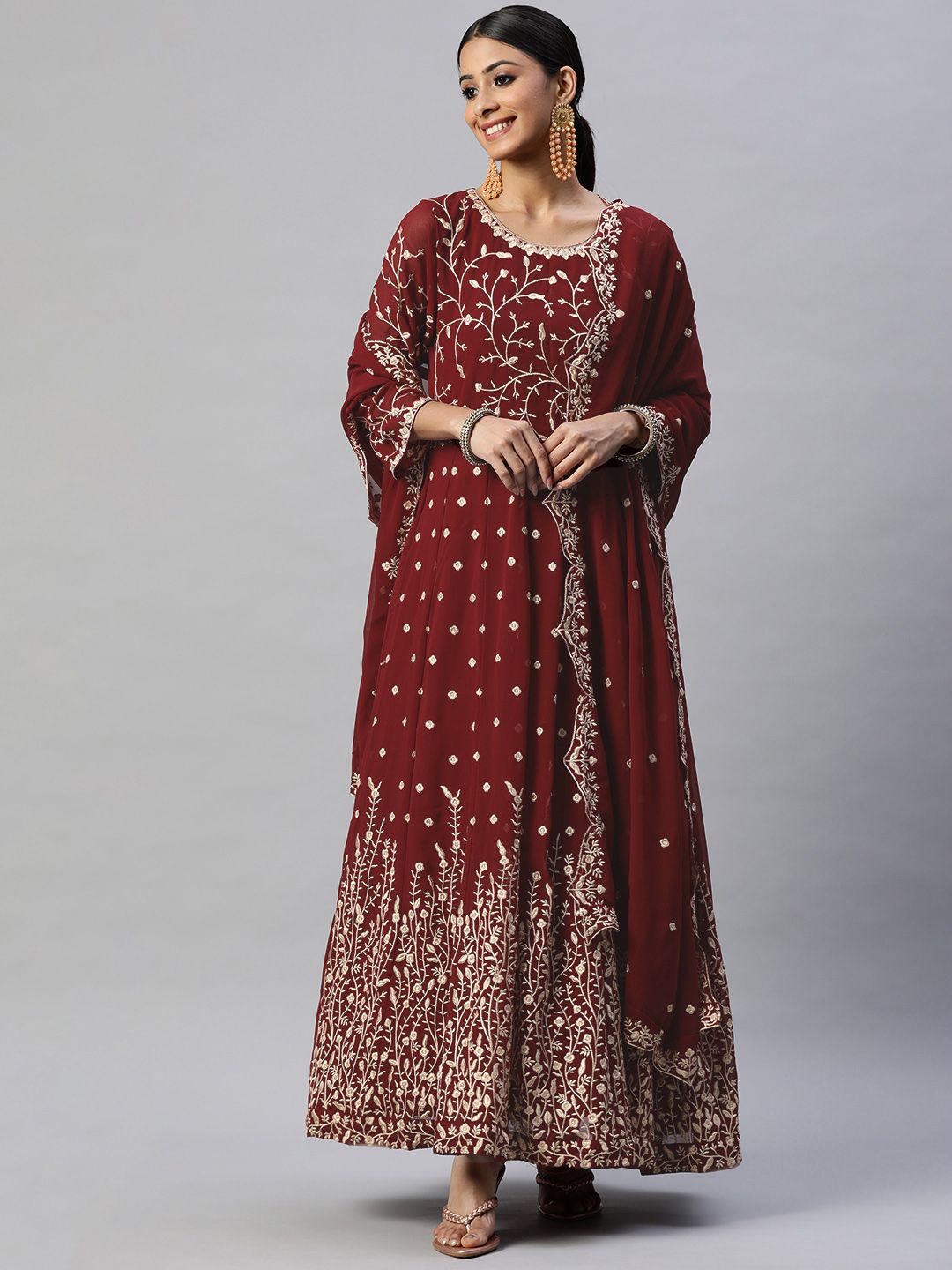 Readiprint Fashions Maroon & Golden Embroidered Semi-Stitched Dress Material Price in India