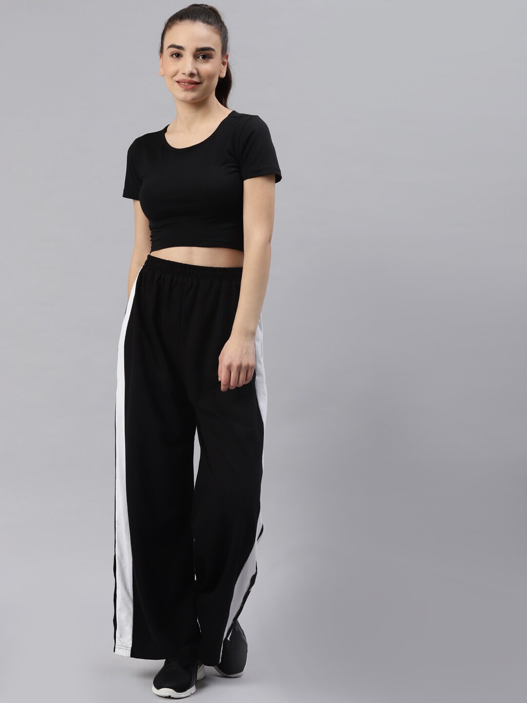 Laabha Women Black Solid Tracksuit Price in India