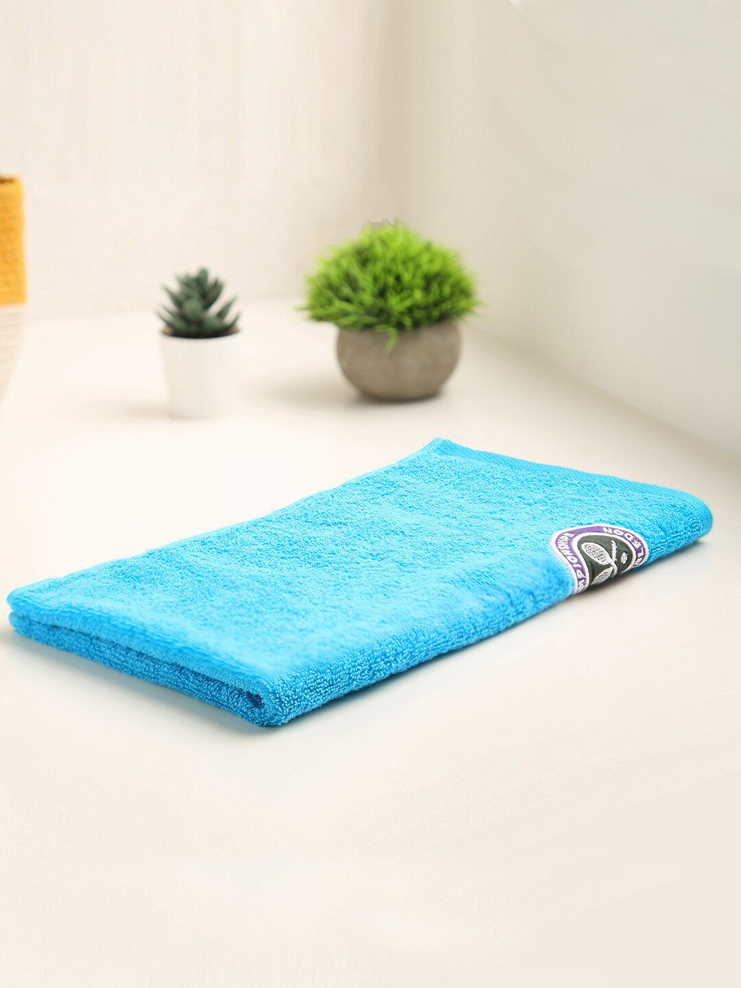 SPACES Blue Solid 520 GSM Cotton Hand Towel Price in India