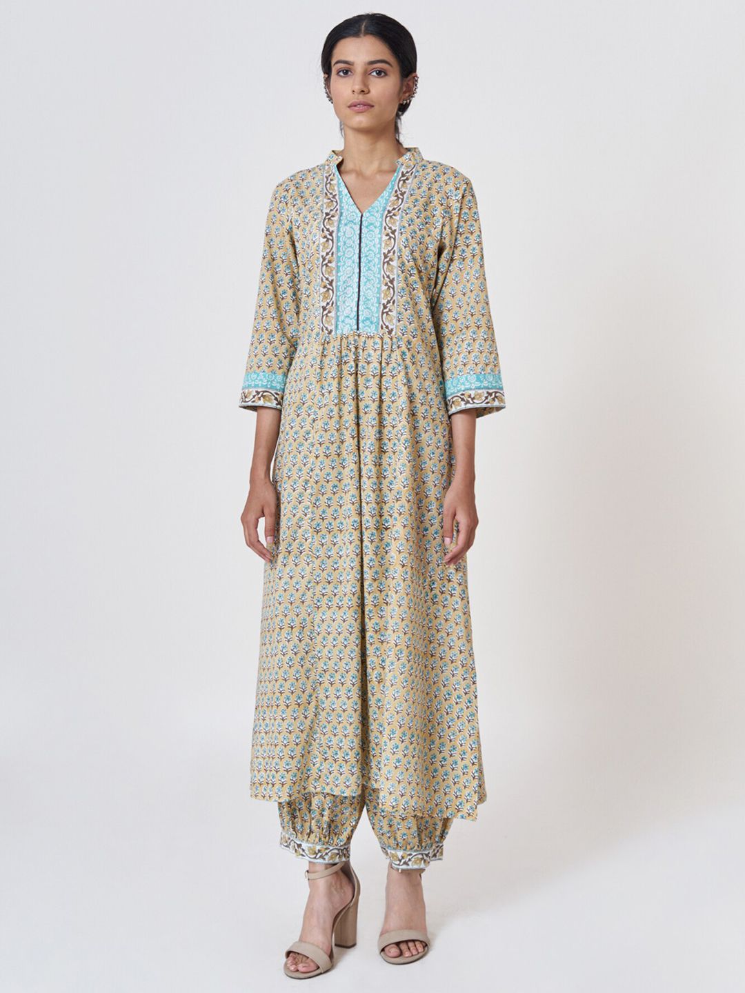 SHRINKHLA Women Mustard Yellow & Beige Printed Cotton A-line Kurta Price in India