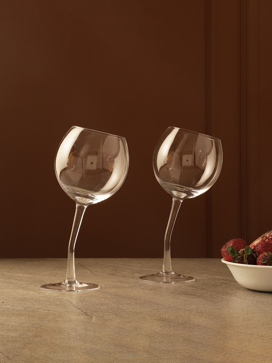 The Decor Mart Set Of 2 Transparent Solid Dancing Wine Glass Price in India