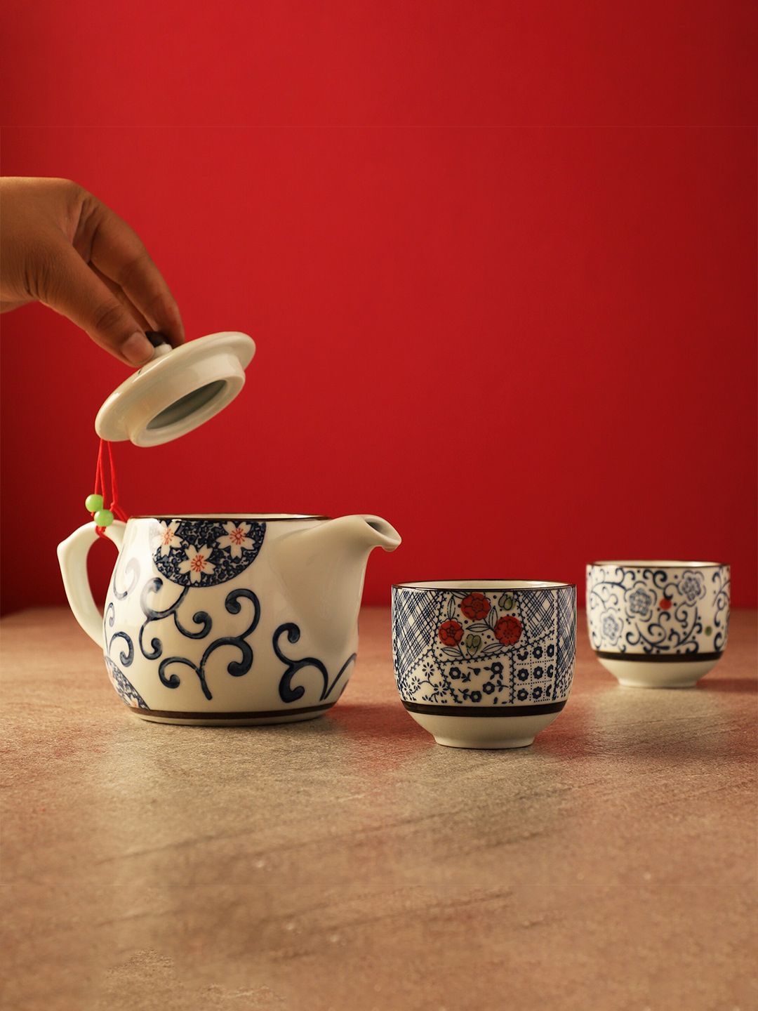 The Decor Mart White & Blue Floral Printed Ceramic Glossy Kettle Set of Cups and Mugs Price in India