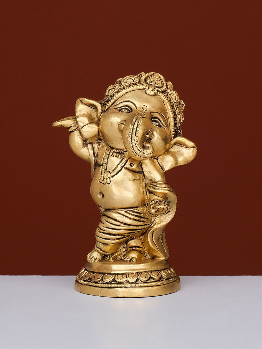 Ekaa Handicrafts Gold-Toned Dancing Brass Ganesha Showpiece Price in India