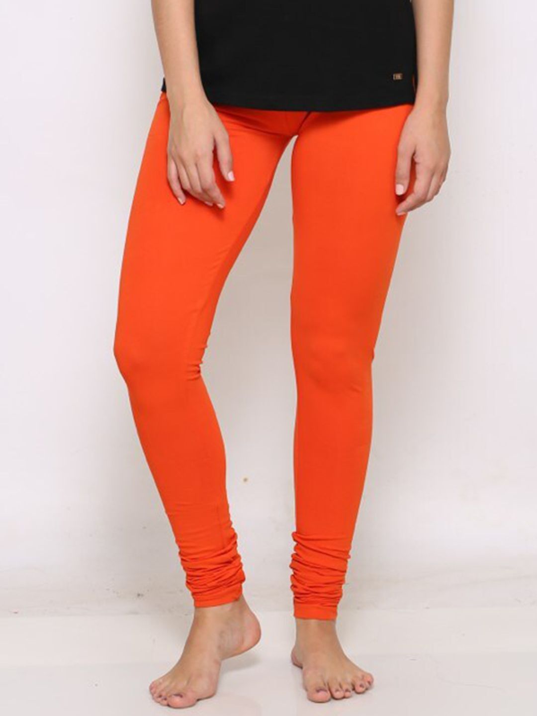 Prag & Co Women Orange Solid Super Combed Cotton Churidar-Length Leggings Price in India