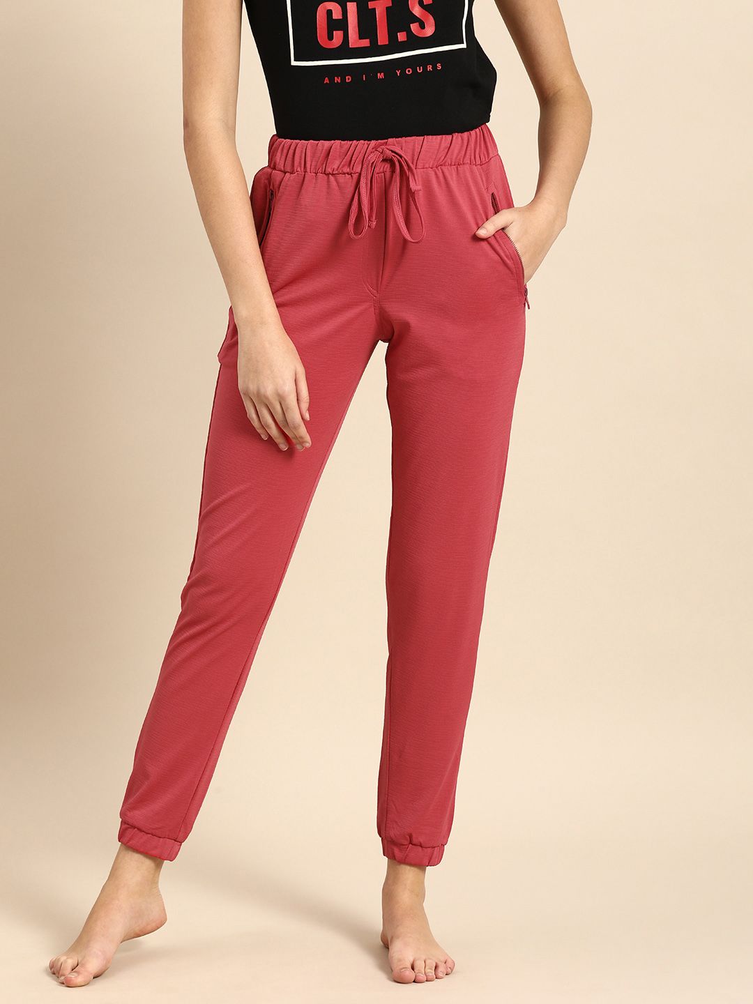 Clt.s Women Coral Red Solid Slim Fit Joggers Price in India