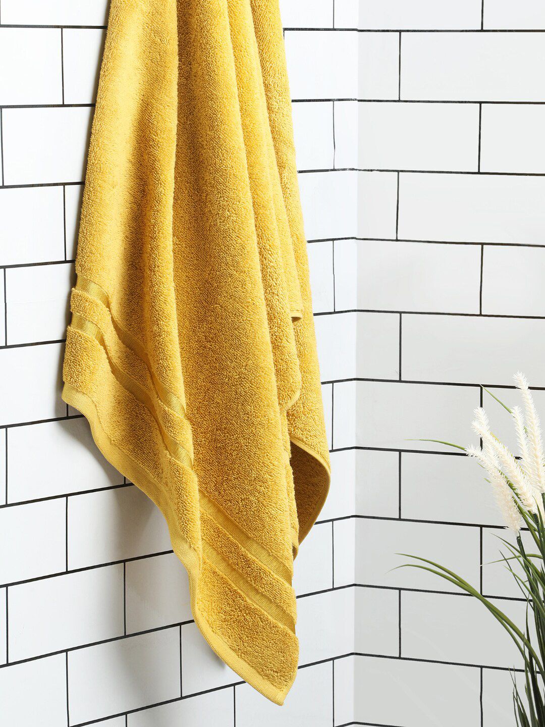 SPACES Mustard Solid Pure Cotton 500 GSM Bath Towel Price in India