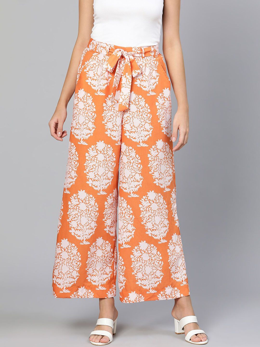 Oxolloxo Women Orange Floral Printed Trousers Price in India
