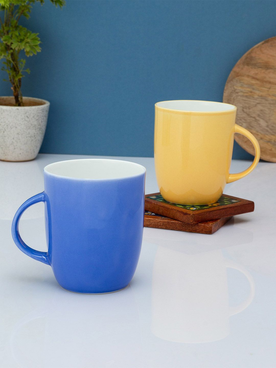 CLAY CRAFT Blue & Yellow Solid Ceramic Glossy Mugs Set of Cups and Mugs Price in India