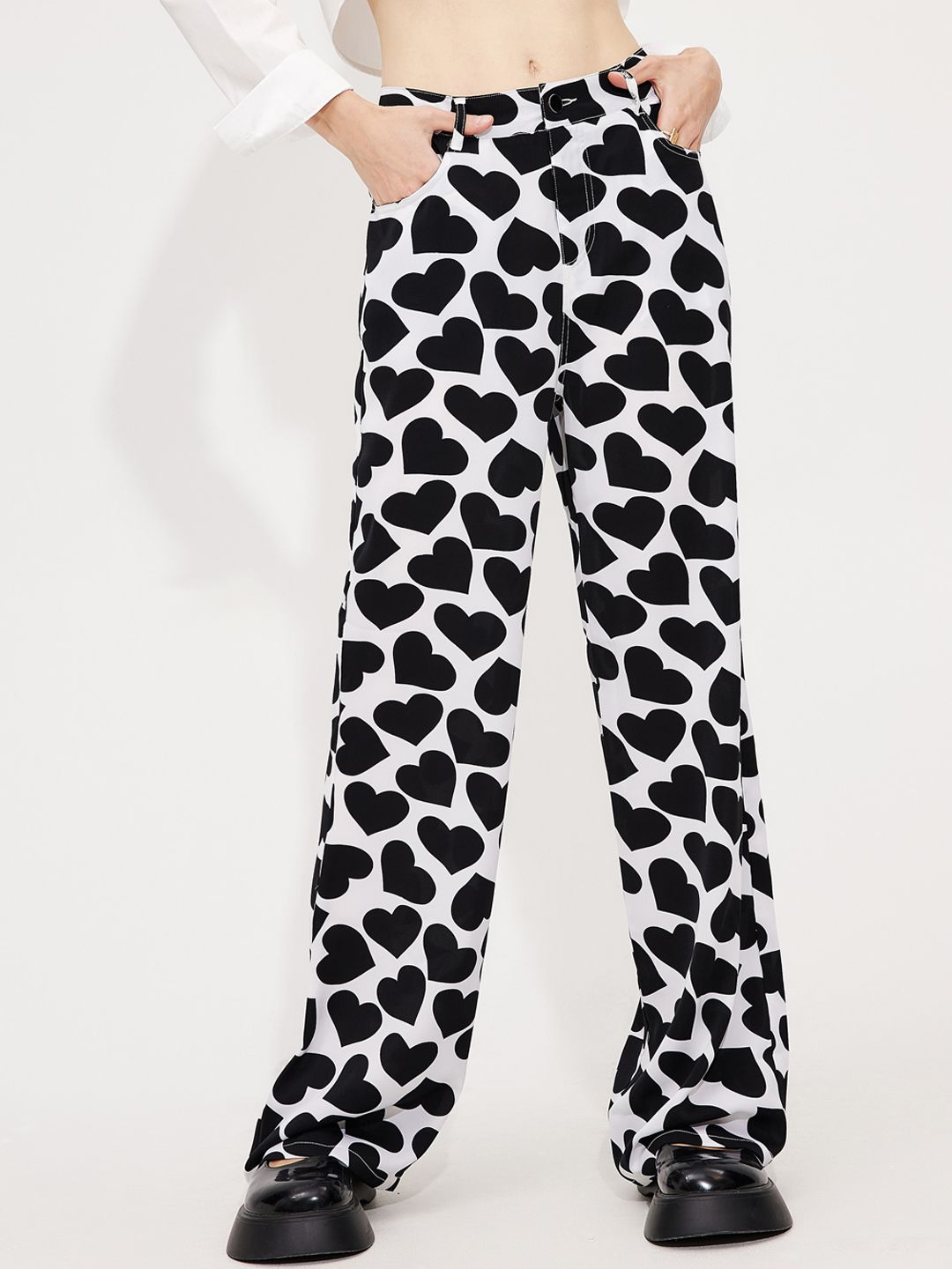 URBANIC Women Black Animal Printed Trousers Price in India