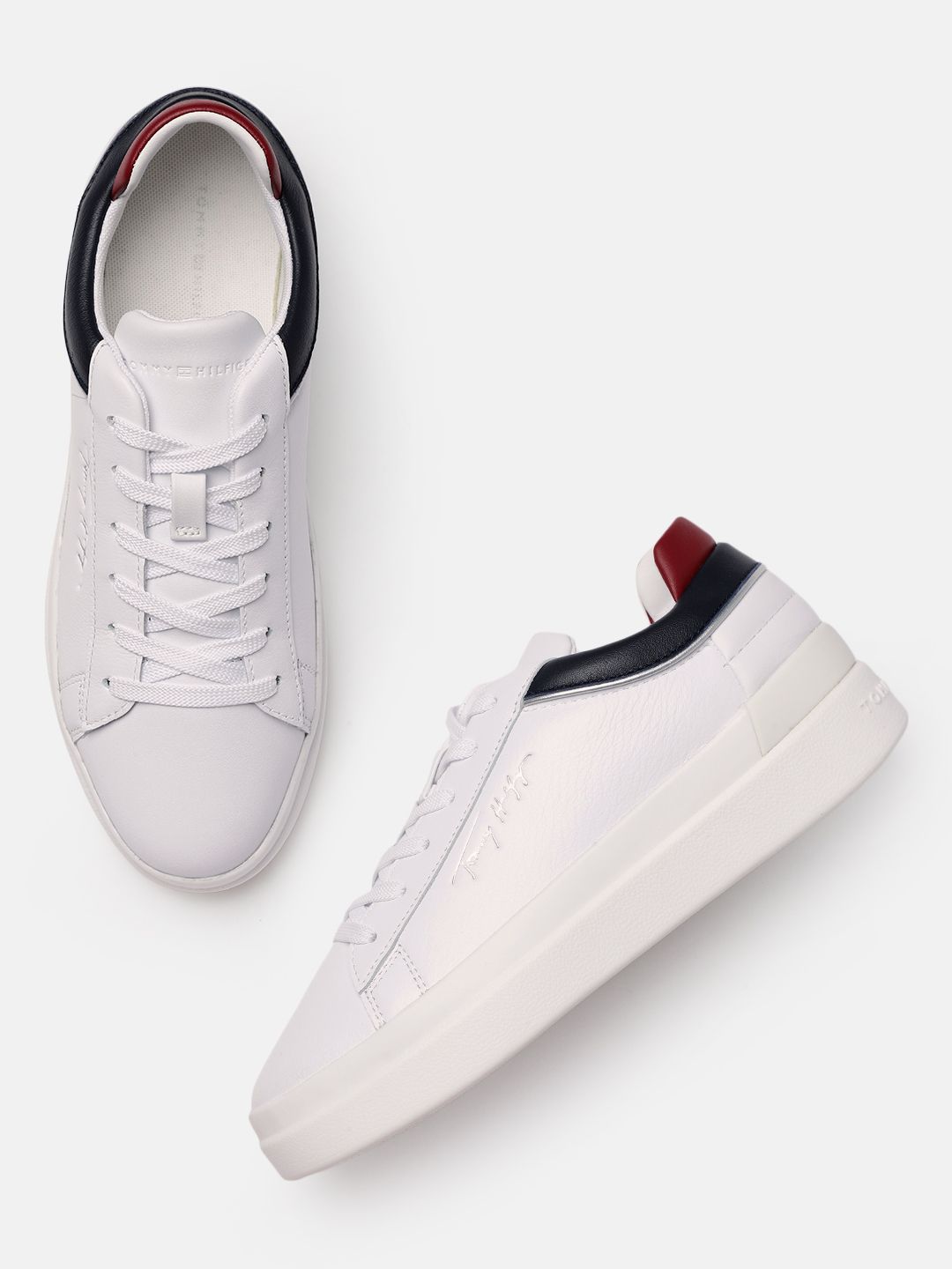 Tommy Hilfiger Women White Solid Leather Regular Sneakers with Brand Logo Embossed Detail Price in India