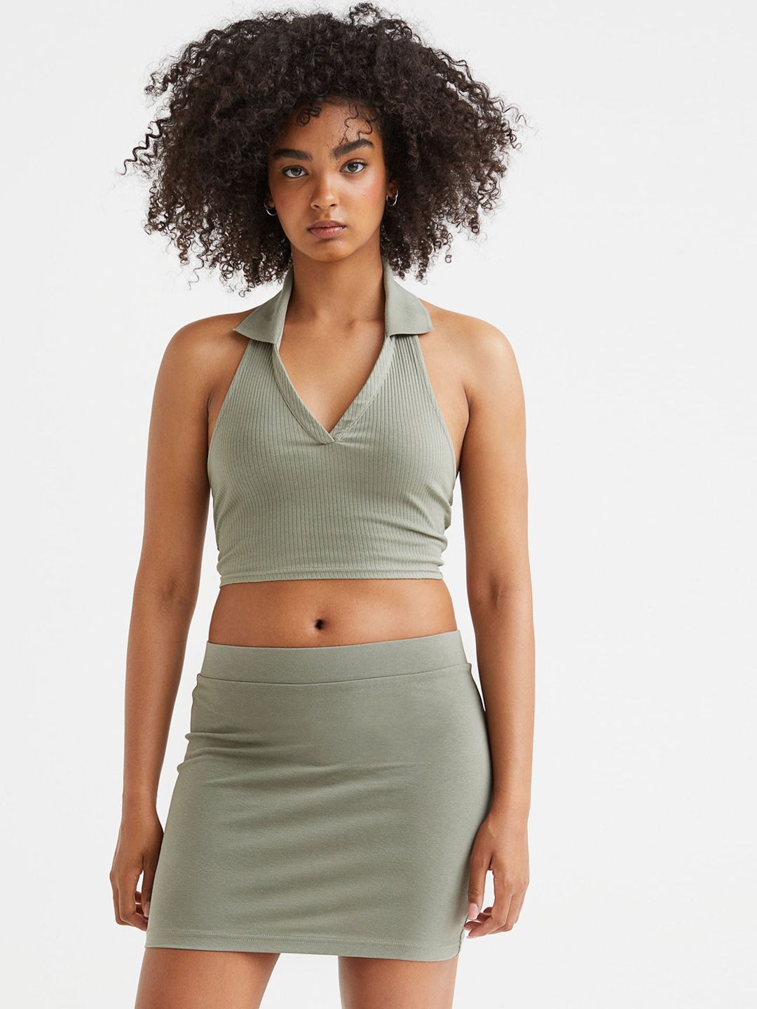 H&M Women Green Solid Mini Skirts Price in India