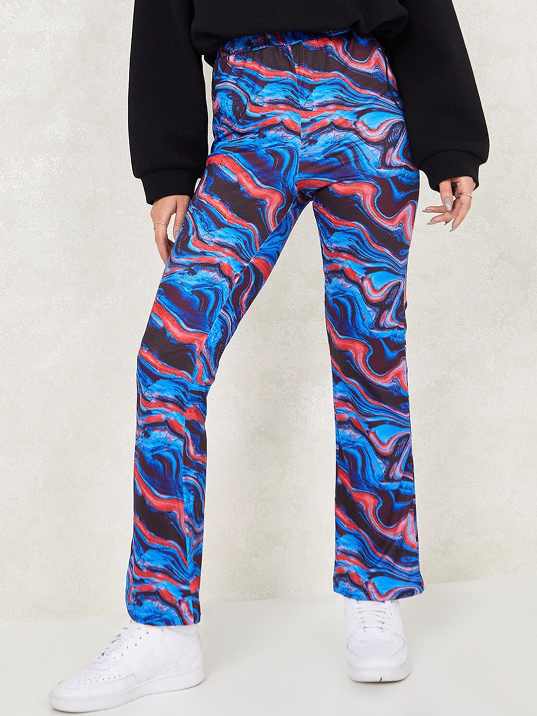 Styli Women Blue Printed Flared High-Rise Trousers Price in India