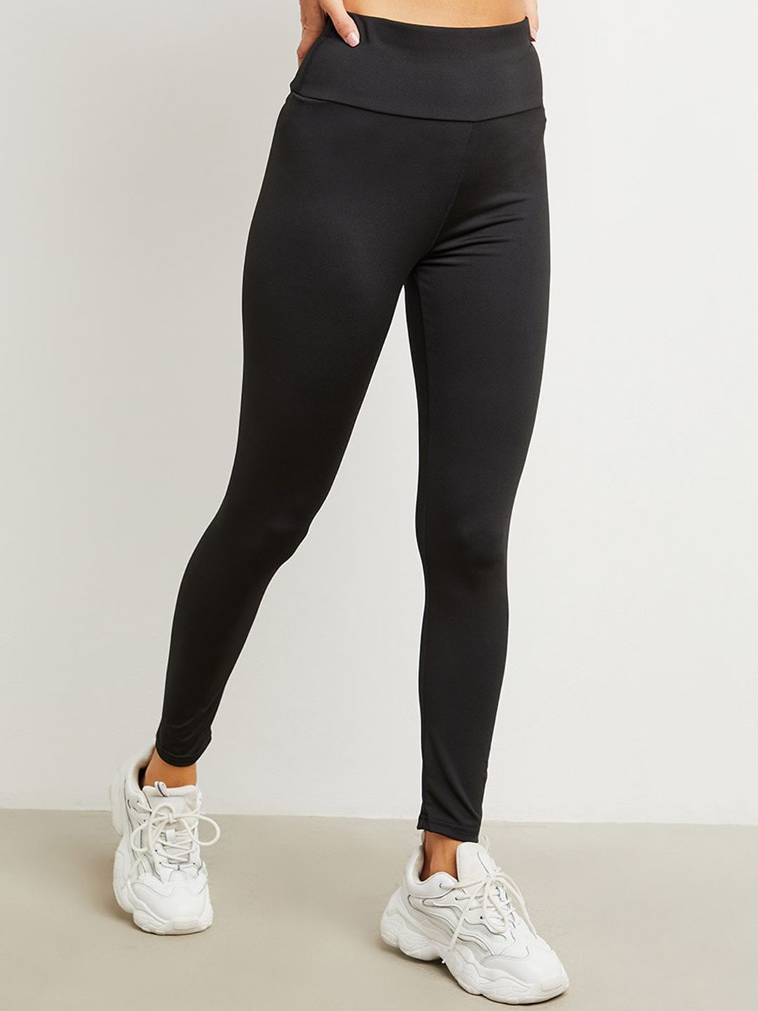 Styli Women Black Solid Back Strap Detail Sports Tights Price in India