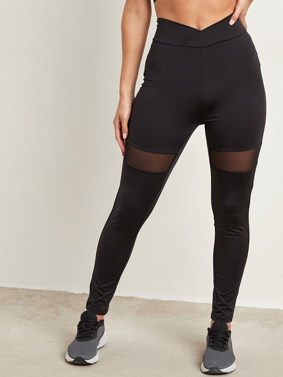 Styli Women Black Solid  Mesh Insert Panel Activewear Tights Price in India